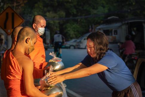 Giving food to monks