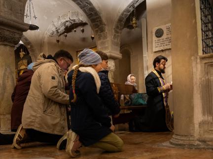 Praying at St Nicholas Crypt