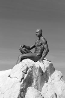 Nude man on the stone