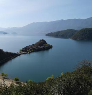 Mountains surround water 13
