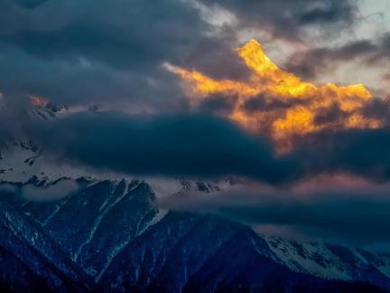 Golden Peak above the clouds 2