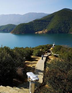 Mountains surround water 18