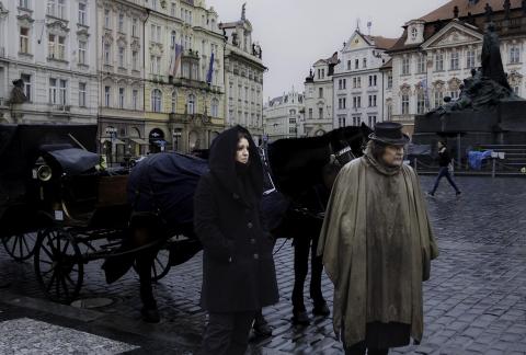 A carriage driver in the cold rain