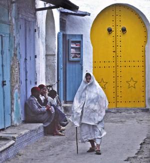 Tunisia woman with cane Douz