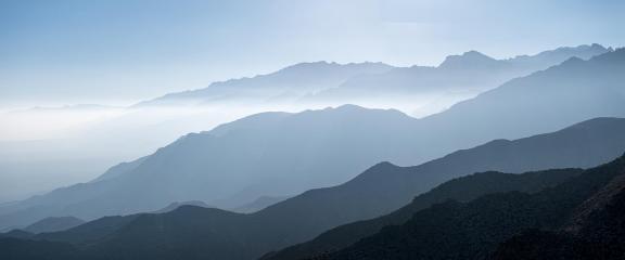 Ridges Layered into Misty Clouds​