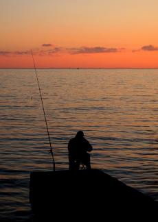 Silhouette of a fisherman