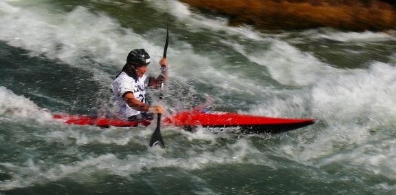 Woman Kayaker Rushing