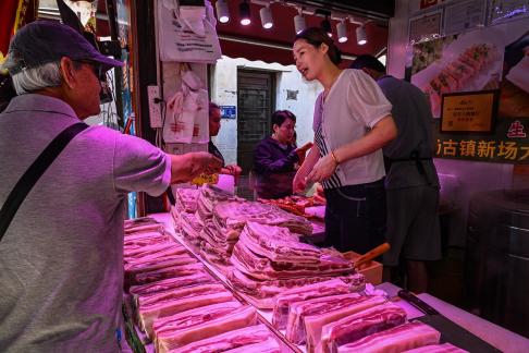 Selling Meat at Xinchang Old Town