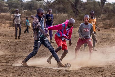 Playing Football in Sand 8