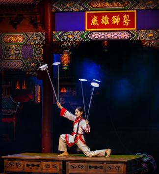 A girl holding six dishes