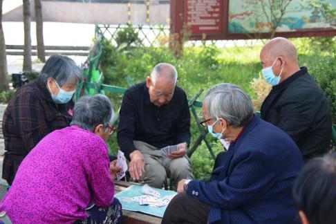 old man playing poker