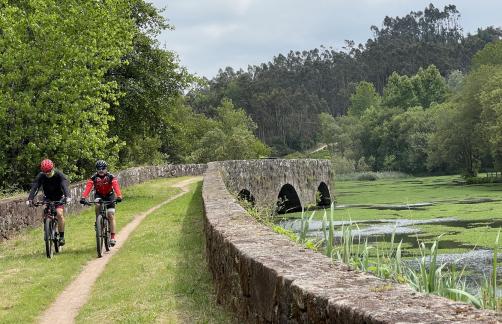 Cyclists on the medieval bridge