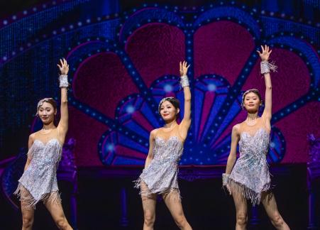Three Chinese girls dancing
