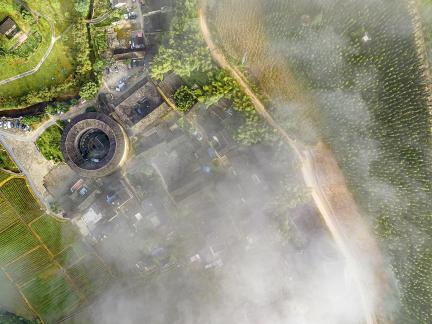 Tulou under misty clouds