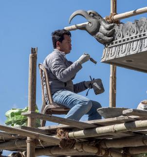 Temple Worker With Brush