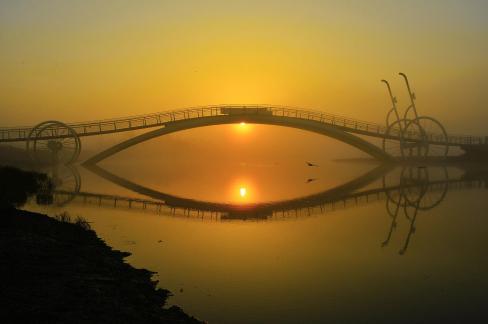 the sunrise of a bicycle bridge 06