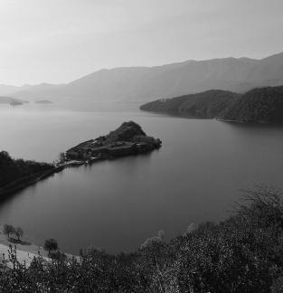 Mountains surround water 13