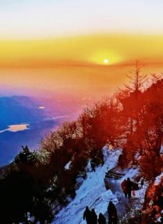 Snow red sunset and climbers